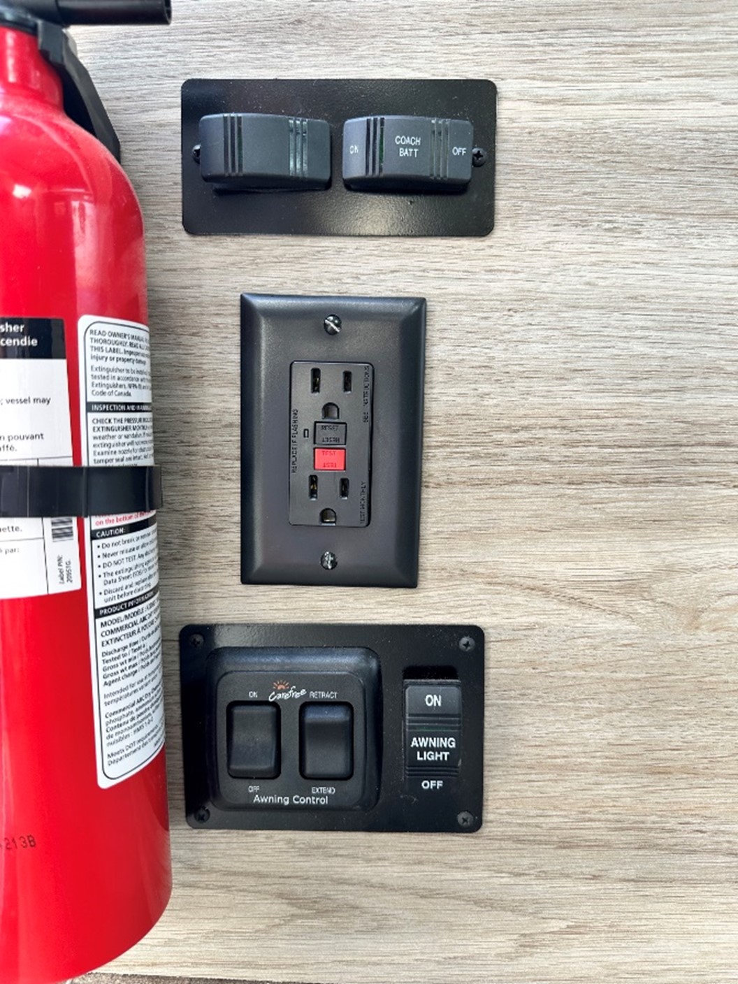 Awning_control_buttons_Couple_Condo_Winnebago.jpg
