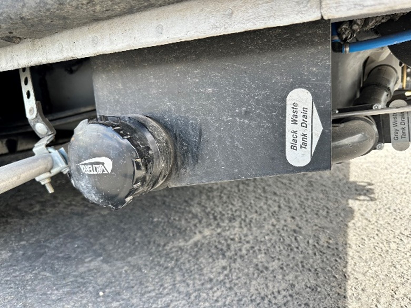 Winnebago_Couple_Condo_hose_connections_and_drain_valves.jpg